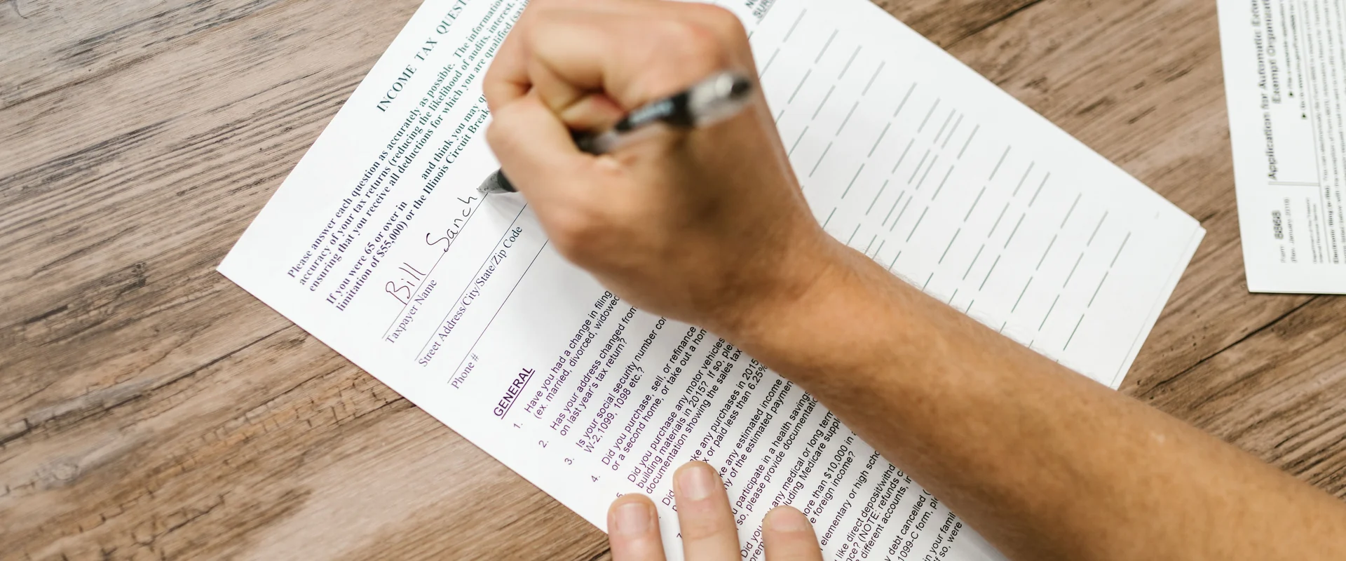 Tax paperwork on a desk with a calculator