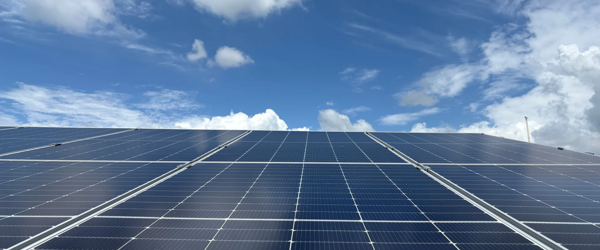 Close up of photovoltaic cells with sunlight across the surface