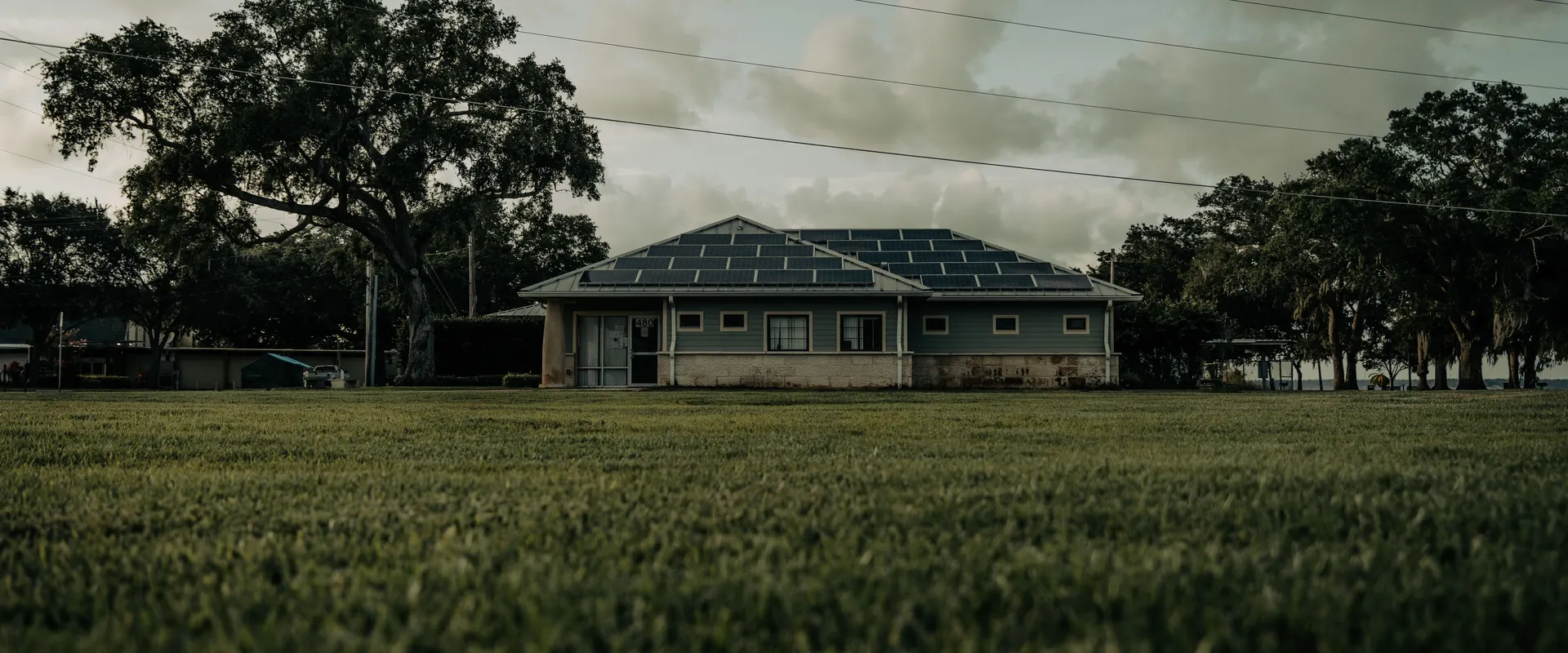 A residential solar roof under a partly cloudy sky