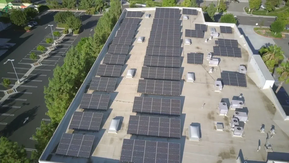 Aerial view of a commercial rooftop solar array